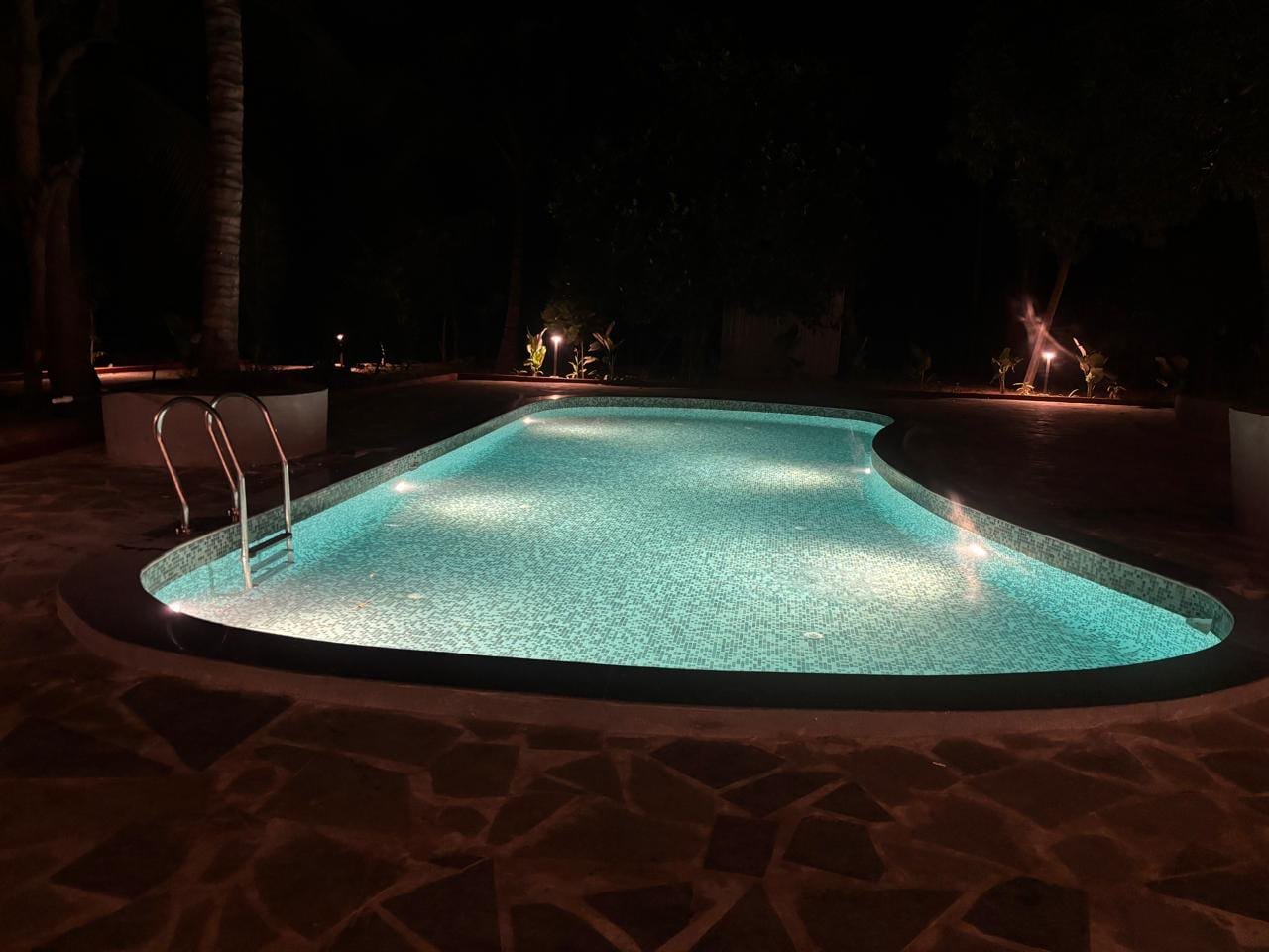 Completed swimming pool with underwater lighting